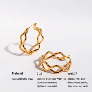 Fashionable double wave hoop earrings in gold plated brass with snake texture design