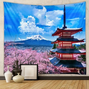 Mt Fuji and pagoda tapestry with cherry blossoms hung over a minimalist home setting