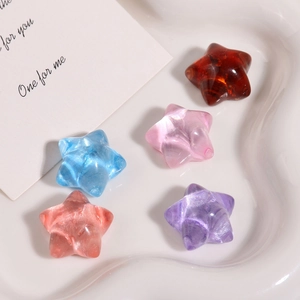Colorful star-shaped resin beads for DIY jewelry making in a decorative tray