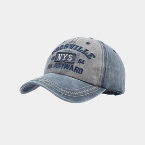 Detail of vintage washed denim baseball cap with NYS embroidery and stitched brim