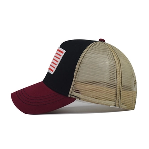 Three-color mesh trucker hat with American flag stripe patch and burgundy curved brim