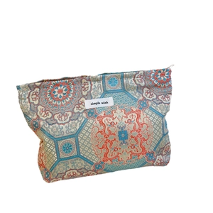 Traditional Chinese brocade storage bag with elegant oriental floral jacquard patterns