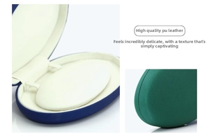 Detailed view of oval jewelry box in dark green PU leather with soft velvet lining