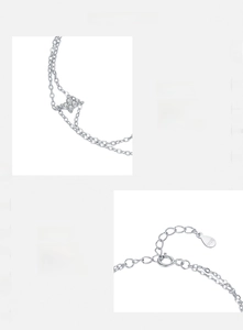 Detailed close-up of S925 hallmark on silver double-layered four-leaf clover bracelet