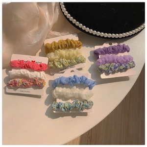Detailed set of floral and solid scrunchies in chiffon and silk fabric with pearls