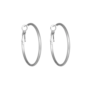 Detail shot of large polished silver steel hoop earrings with secure clasp mechanism