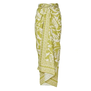 Olive green sarong wrap with tropical white floral print and a knotted waist design