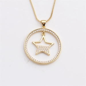 Close-up of gold hollow pendant necklace with star and cross patterns and CZ stones