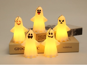 Detailed view of five white Halloween ghost lanterns with warm LED lights and hanging loops