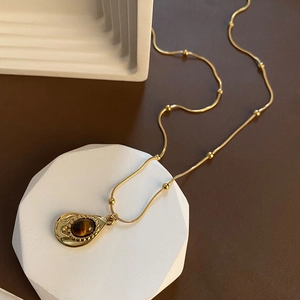 Collana con ciondolo a goccia in occhio di tigre in acciaio inossidabile dorato donna