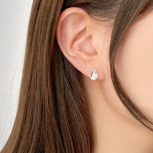 Minimalist 925 sterling silver teardrop stud earring with blue glow moonstone effect