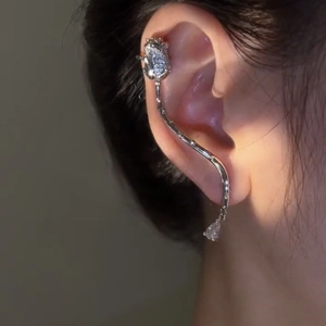 Close-up of silver rose ear cuff with sparkling zircon floral patterns and water drop pendant