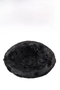 Close-up of winter faux fur hat featuring warm quilted diamond pattern inner lining