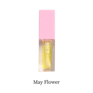Detail of clear hydrating lip oil in a rectangular bottle with pink frosted cap and applicator