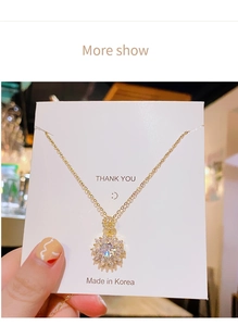 Detailed close-up of a luxury gold flower necklace with sparkling pave-set zircon stones