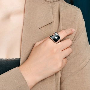 Modern minimalist wide concave stainless steel ring with a polished silver finish for women