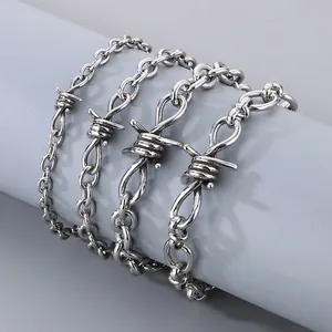 Silver stainless steel barbed wire link bracelet with a punk and industrial aesthetic