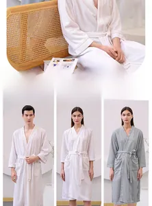 Close-up detail of breathable waffle weave cotton bathrobe with V-neck and waist tie design