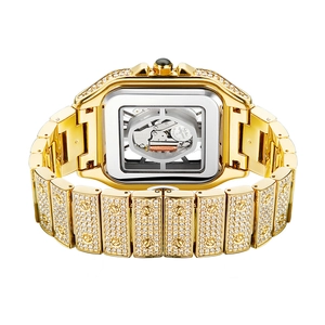 Close-up of gold iced-out square watch case showing Miyota Japan quartz movement detail