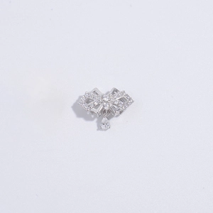 Macro detail of S925 sterling silver bow pendant with shimmering zircon water drop