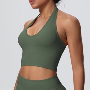 Close-up of olive green ribbed yoga bra featuring halter neck and seamless fabric detail
