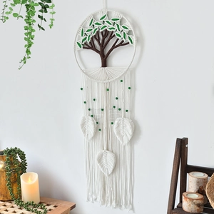 Bohemian handmade macrame wall hanging with tree of life design and long white tassels