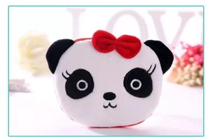 Detail of cute plush panda coin purse with soft texture and a small red bow tie decor