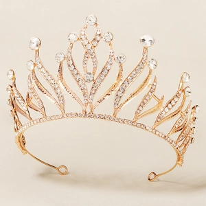 Detailed close-up of a golden baroque tiara with sparkling crystal rhinestones and alloy frame