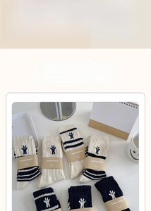 Detail of cotton crew socks showing ribbed texture and cute rabbit embroidery decoration