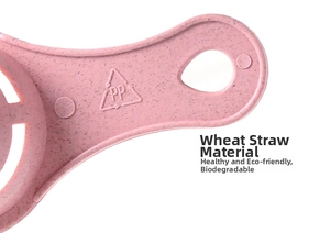 Macro detail of eco-friendly pink wheat straw egg separator handle with hanging hole and PP mark