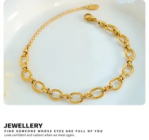 Detail of 18K gold-plated chunky link chain bracelet with lobster clasp and adjustable links