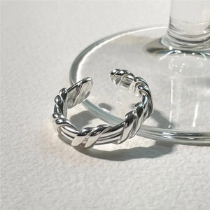 Macro detail of silver S925 sterling silver twisted braid adjustable ring design