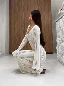 Elegant white V-neck knitted dress with hollow lace details and long flare sleeves