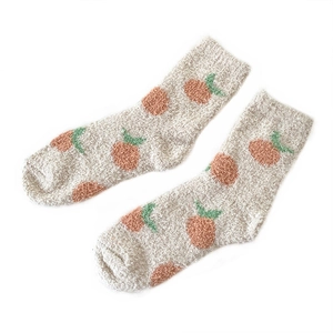Women's thermal coral fleece socks with cute orange patterns for winter warmth