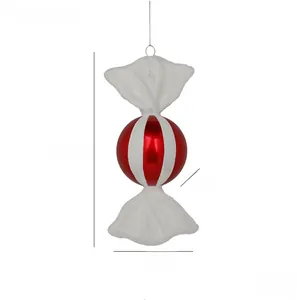 Detail of red and white striped candy Christmas ornament showing dimensions and texture