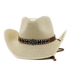 Macro view of woven straw cowboy hat with leather band and metal rivet ornaments