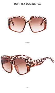 Front and side views of irregular oversized leopard print sunglasses with gradient tea lenses