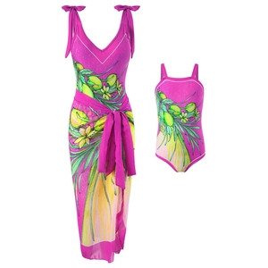 Matching mother and daughter one-piece swimsuits with vibrant pink floral and lemon print
