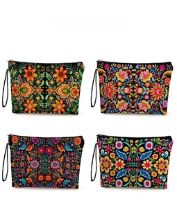 Detail showing four different Mexican folk floral patterns on zippered toiletry bags