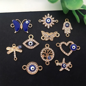 Detailed assortment of gold alloy Evil Eye charms with rhinestones and enamel accents