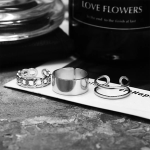 Three-piece set of silver hip hop rings including chain and wide smooth band styles