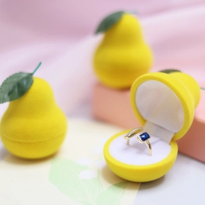 Cute yellow pear shaped velvet ring jewelry gift box detail view for small accessories storage.