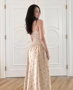 Detail of floral spaghetti strap maxi dress with smocked back and lace patchwork