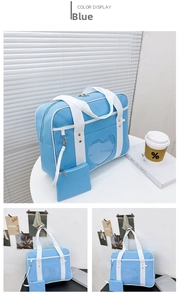 Detail of light blue heart window ita bag with top handles and matching coin purse