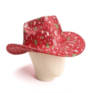 Detail of red glitter cowboy hat with festive white and green snowflake patterns