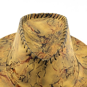 Close-up of western cowboy hat with vintage texture and black cross-stitch detail