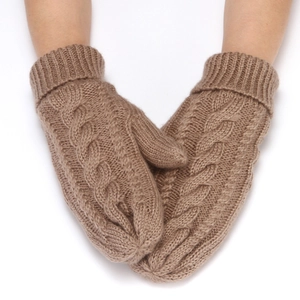 Detail view of khaki cable-knit mittens showing soft wool texture and patterns