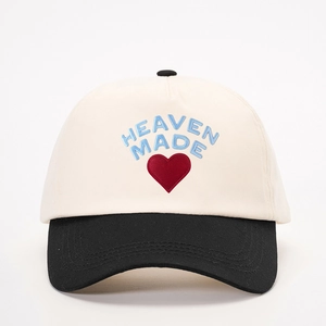 Classic cream and black baseball cap featuring HEAVEN MADE embroidery and a red heart