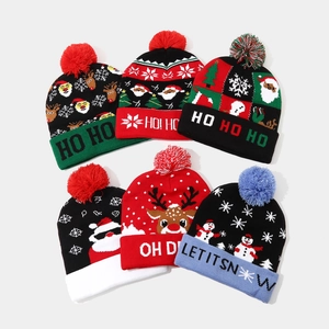 Knitted Christmas beanies set with festive patterns like reindeer and snowmen with pom-poms