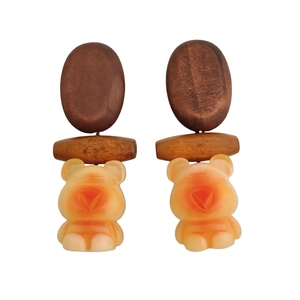 Handcrafted bear earrings with wooden oval beads and orange resin pendants for women